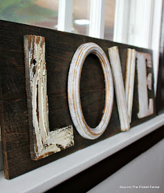 love sign with painted letters attached with a brad nail gun