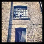 Smashed windows in Vinegar Street