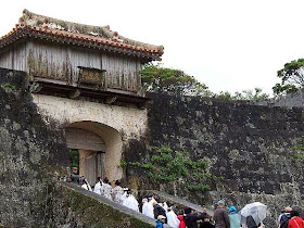 worshipers entering castle via stone stairs