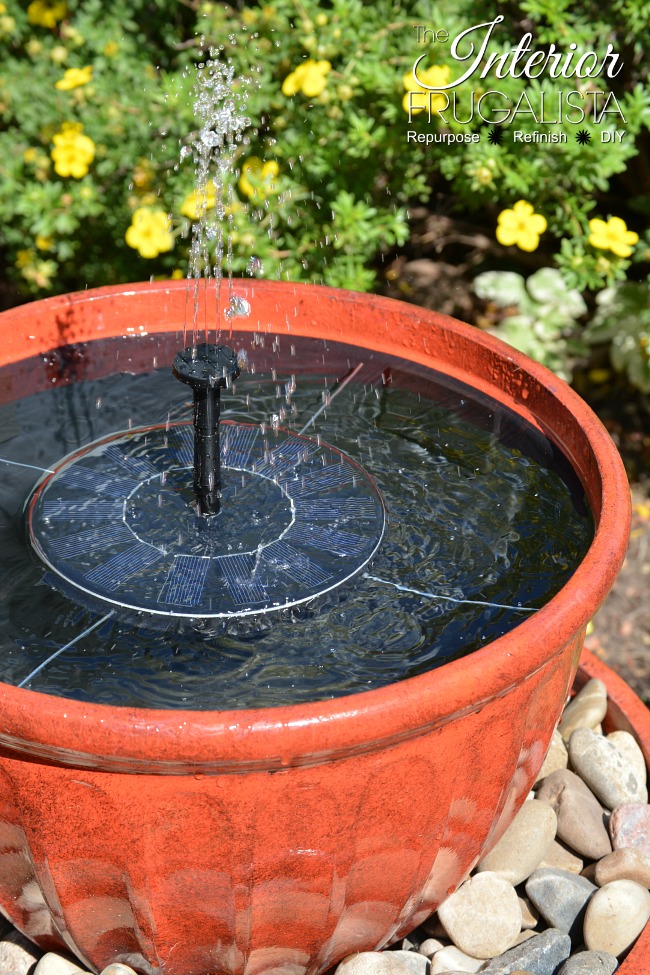 How to make a backyard solar plant pot water fountain in under fifteen minutes with stacked flower pots perfect for a deck, patio, porch, or balcony.