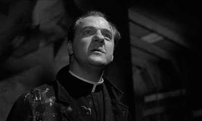 Father Barry (Karl Malden) delivers a sermon, one that's as angry as it is heartfelt.