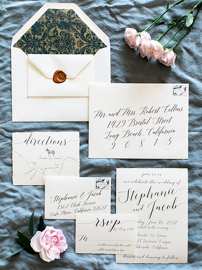 Calligraphy wedding invitations | Photo by Dennis Roy Coronel | See more on thesocalbride.com