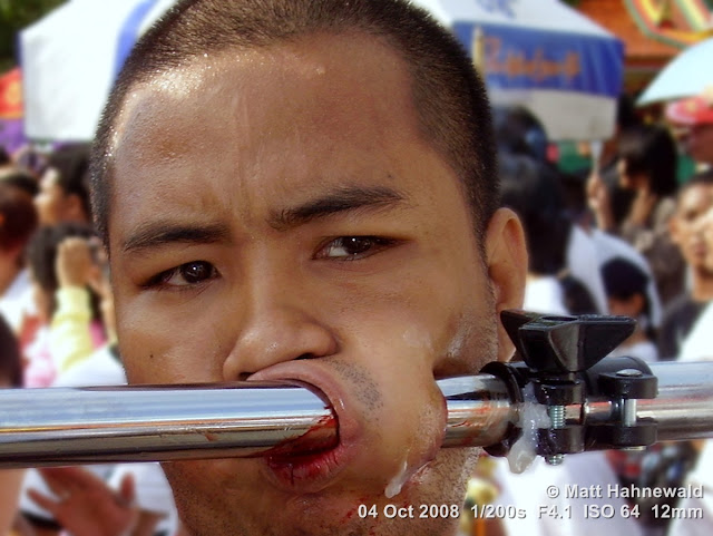 Thailand, Phuket, Vegetarian Festival, Tesagan Jia Chai, Nine Emperor Gods Festival, Taoist celebration, Thai Chinese man, mah song, street portrait, self-mutilation, piercing, impaling, ritualised mutilation