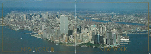 Postcard photo showing the whole of lower manhattan with the twin towers standing higher than all the other tall buildings