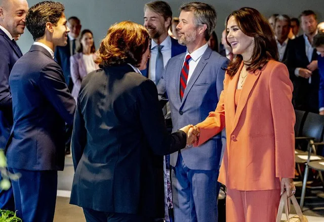 Crown Princess Mary wore coral tailored jacket and tailored wide-leg trousers, and orange top by Scanlan Theodore