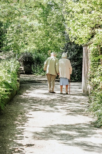 elderly couple walking and maintaining independence at home