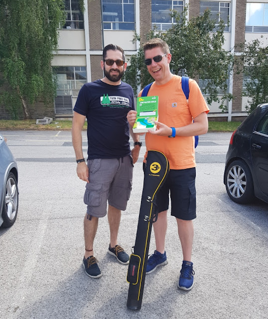 Elliot and Richard in Glossop - with another copy of The Miniature Book of Miniature Golf by Mike Vago heading into The Crazy Golf Museum