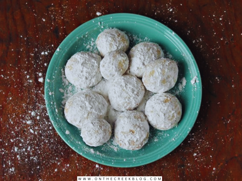 Delicious homemade Snowball Cookies made by Tiff, featuring a dusting of powdered sugar, embodying the festive spirit of Christmas baking. | on the creek blog // www.onthecreekblog.com