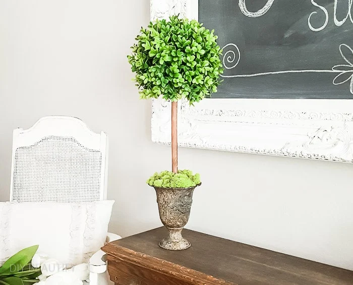 large boxwood topiary with faux greenery