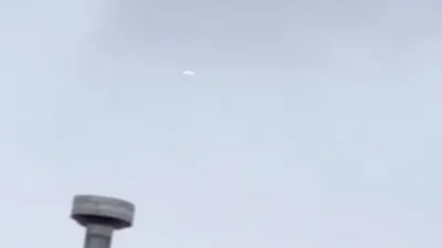 UFO sighting over Beaverton Oregon USA pill shaped.