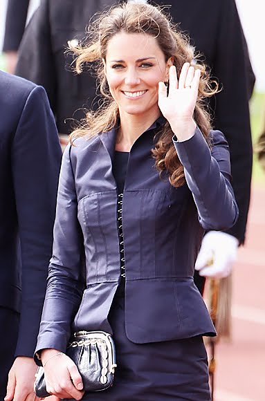 On Kate Middleton's Fashion She wore a navy skirt suit for her appearance 