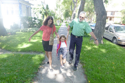 Wallace and Nancy Braud escorting Grace to first day of kindergarten in Winnipeg, Manitoba