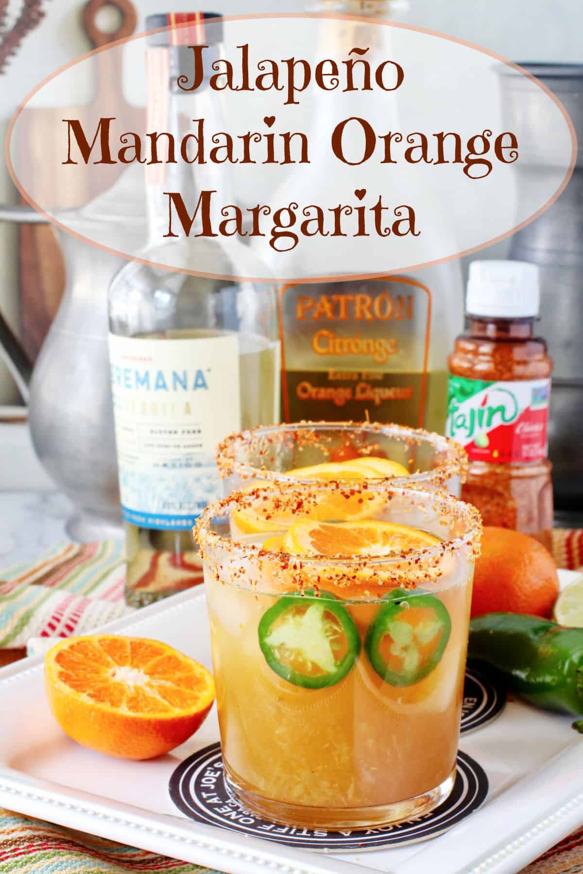 Jalapeño Mandarin Margarita surrounded by its ingredients.