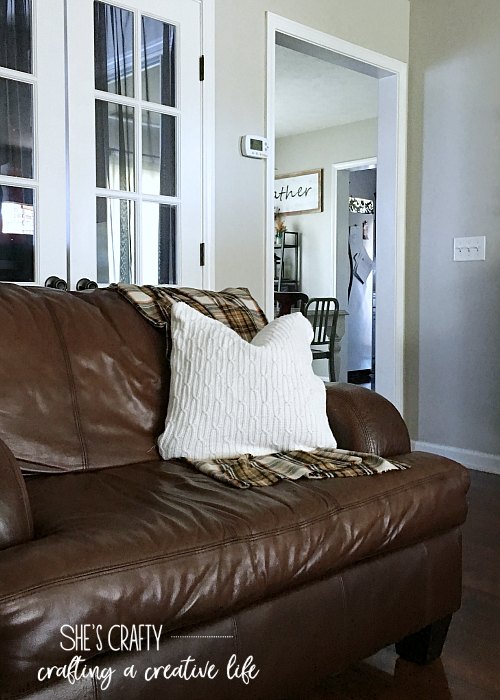 throw pillows, brown leather couches