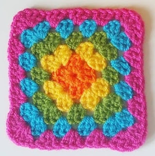 Picture of a 5 round granny square - orange, yellow, green, blue, pink