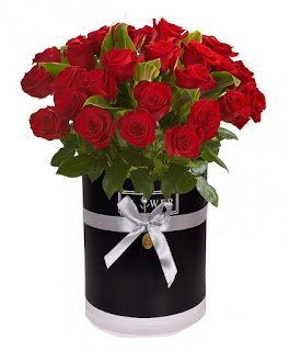 Red roses arranged in black box for birthday gifts