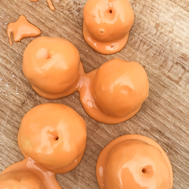 Iced balls on a wooden chopping board 