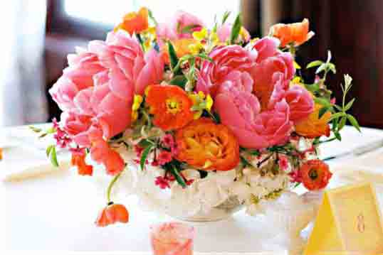 Wedding Flowers Mix in some different hues of corals oranges and pinks