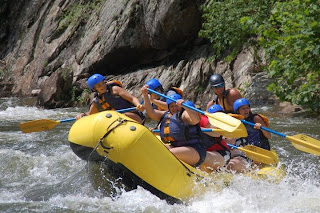 Coming into the rapids, heros up front, chickens in the rear.