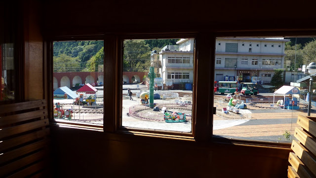 View of miniature rides from inside train