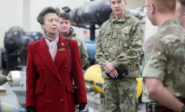 Princess Anne is President of the Commonwealth War Graves Commission. Princess Anne wore a red coat by Max Mara