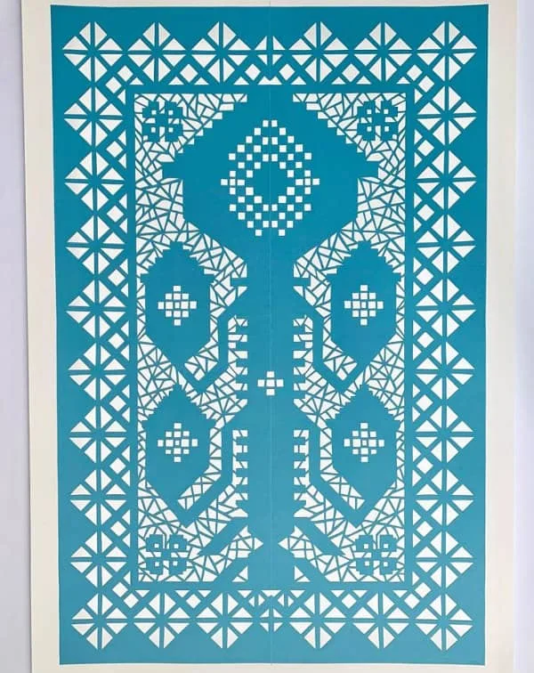 small, detailed aqua papercut panel