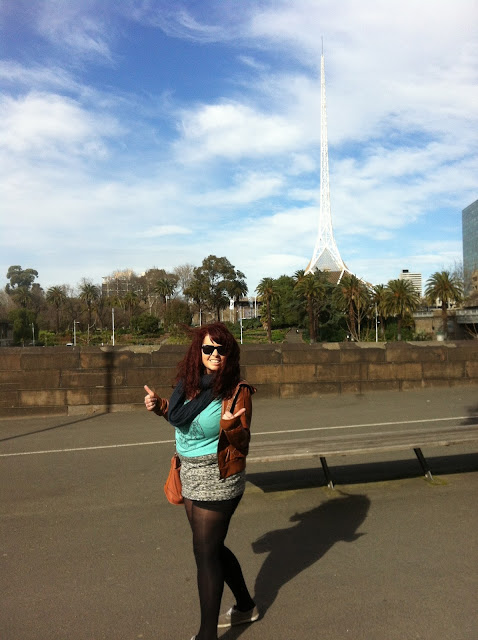 Amy with the National Art Gallery touching the sky in the distance.