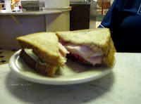 Click to enlarge -  Turkey sandwich with lettuce and tomato.