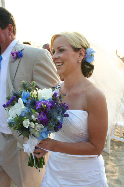So for her bouquet she had white lilies blue orchids purple delphinium 