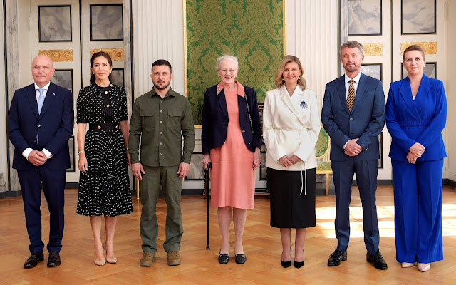 Crown Princess Mary wore a black polka-dot pleated dress by Prada. First Lady Olena Zelenska and President Volodymyr Zelensky
