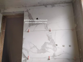 Small bathroom tile design with black and white tiles