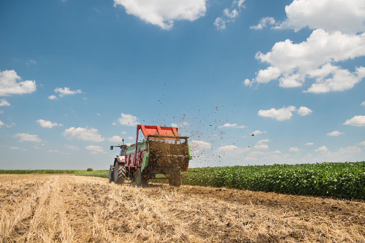 farmer spreading Manure