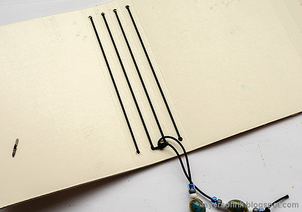 Layers of ink - Chickadee Wrapped Journal Tutorial by Anna-Karin Evaldsson. Bind the journal.