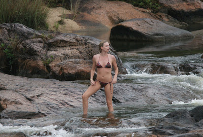 Charlize Theron Wearing A Bikini On The Rocks