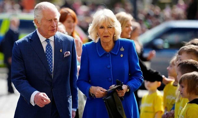 King Charles and Queen Camilla met with Eurovision contestant Mae Muller. The Queen wore a blue wool coat. Eurovision 2023