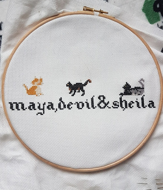 cross stitch with three cats