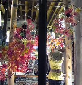 bicycle wheels and plastic flowers