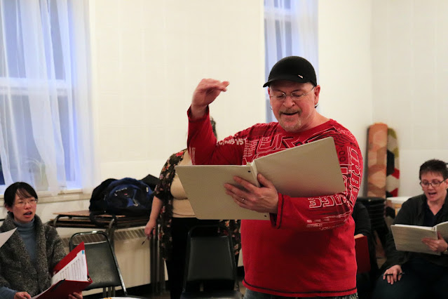 Stairwell Caroller Director, Pierre Massie IN THE ZONE