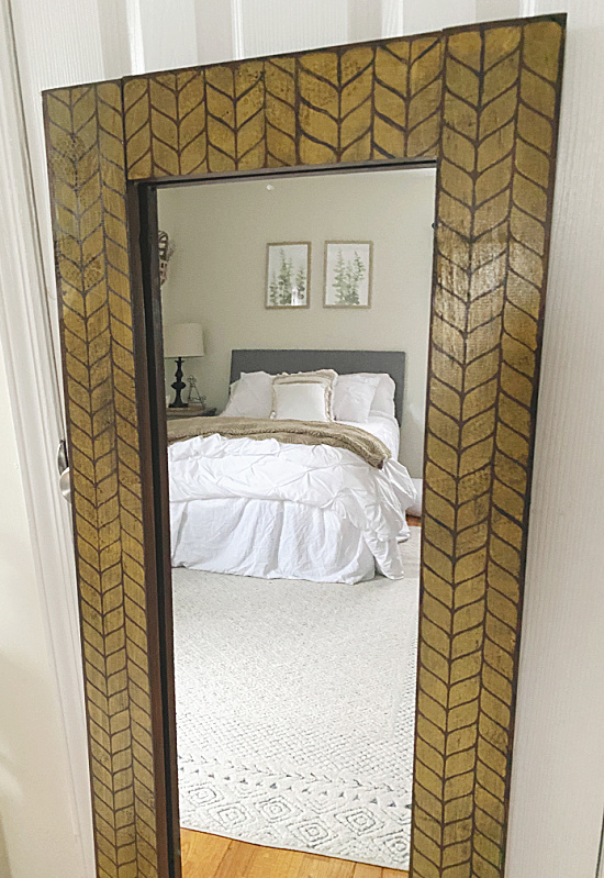 stenciled mirror in bedroom