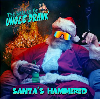 graphic of Santa with a beer bottle in his hand, a cigar in the other hand and mirrored sunglasses on.
