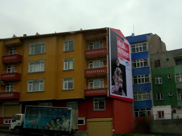 Colorfully painted apartment buildings off the side of the highway in Istanbul.