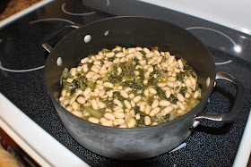 Italian Escarole & Beans is a thick stew like soup that is over Italian day old bread. Also called greens and beans.