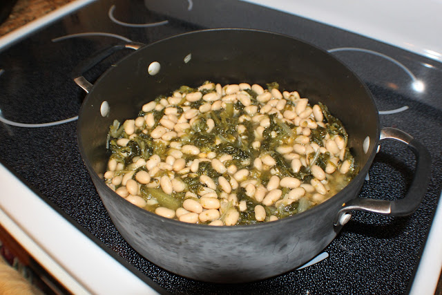 Italian Escarole & Beans is a thick stew like soup that is over Italian day old bread. Also called greens and beans.