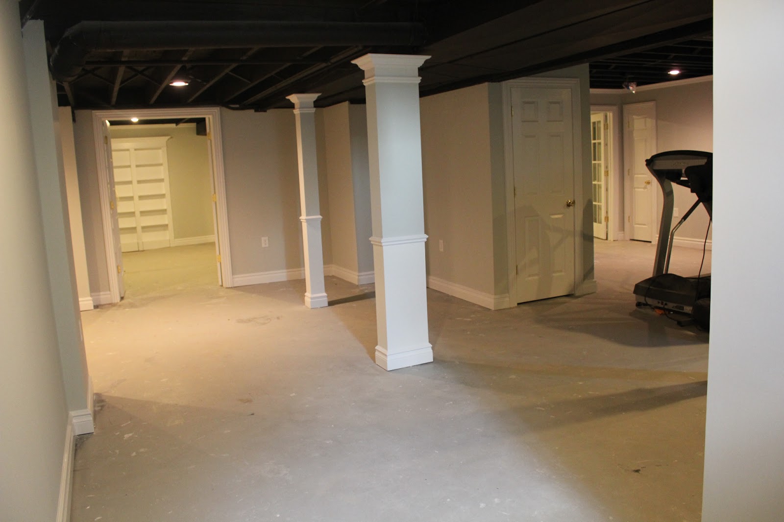 Basement Remodel With Painted Exposed Ceiling