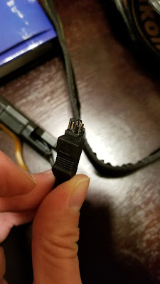 Broken AC power cable for Nikon DSLR.