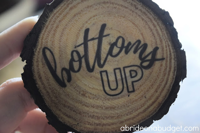 These DIY Wooden Coasters Wedding Favors are perfect for your rustic wedding. You can use actual fresh tree or purchased unfinished wood slices to make them.