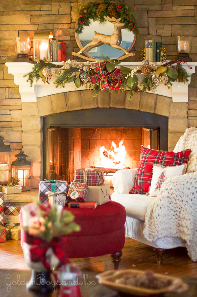 Family room with stone fireplace and classic plaid Christmas decor -www.goldenboysandme.com