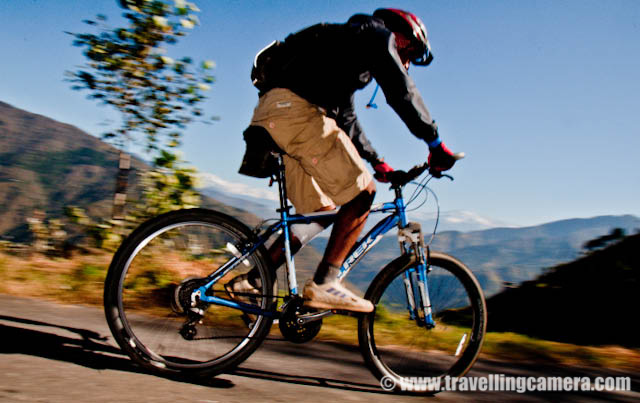 MTB Riders on highest speed in the downhill stretch parallel to snow covered mountain ranges (On Third day) : Posted by VJ SHARMA on www.travellingcamera.com : Hope you have been enjoying this PHOTO JOURNEY through various routes of MTB Himachal 2010... Its 10th post on this great Himalayan event for passionate bike Riders... on third day, I noticed the highest speed of all the riders in a downhill stretch in parallel to snow capped mountain ranges... Check out some of the photographs of this downhill stretch across snow covered hills...First I wanted to give you a feel of the road where we were waiting to catch fast riders of MTB Himachal 2010... Road was situated on a very high hill in parallel to these mountains covered with snow... wonderful place with nice weather and beautiful surroundings...Here comes a group of riders and Cameras are not set to estimate their speed and adjust accordingly... It took time to adjust our cameras to shoot exactly what we wanted to shoot... At least I tried various things with first few riders and was able to identify right place with right settings....They were moving like anything.... Amazing actions, styles n movements...Even folks on the road were moving downwards toward the deep valley to save themselves fom these fast moving riders :) btw he is another Photographer struggling to set himself for shooting this rider...Rider number 41 ... Most of the riders knew each other by their rider numbers and it was difficult to remember the names of everyone but was very easy to know each other by rider nunber because they were sepnding most of the time on the roads crossing each other...Another rider on full speed in the middle of beautiful himalayan mountains in the state of Himachal Pradesh.... Thanks to MTB Himachal 2010...Mr. Ranjan Mandyal playing in air during MTB Himachal 2010... I got a chance to meet some great folks who have passion about bke riding and do lot of other good things in their lives... Ranjan was one of the guy I met and got a chance to understand him better... Hope to meet all of them again :)Here is another MTb rider in style... moving towards the final goal which is near Satluj river near main highway..Amcha rider from Maharshtra Police... a nice photographer as well... He was planning to host an exhibition in Kolkata and also invited us... Hope to see him next year again...Somehow I wanted to share all these photographs in black and white but it would have been unfair to the colorful beauty of surrounding himlayan mountains....Loved this journey and the colors of himalayas...