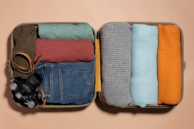 Efficiently packed rolled t-shirt and jeans for travel.