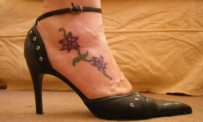 Flower tattoo design in foot